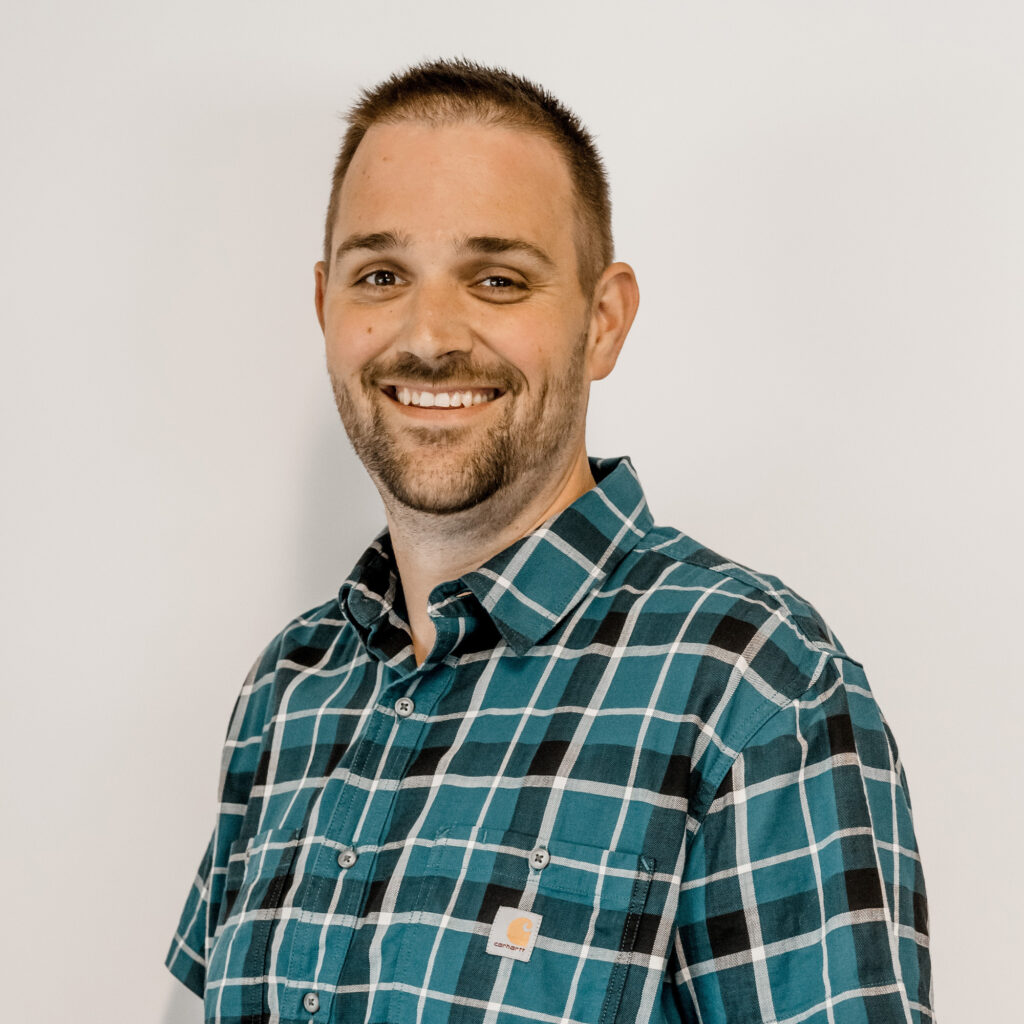 Professional headshot of Chris Wells, Principal Engineer at the Unity Design Group